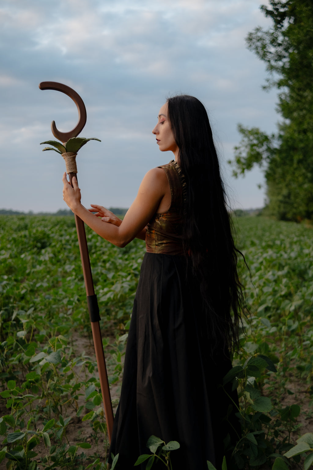 Full length handmade wooden crescent staff with leaf details for fantasy photoshoot
