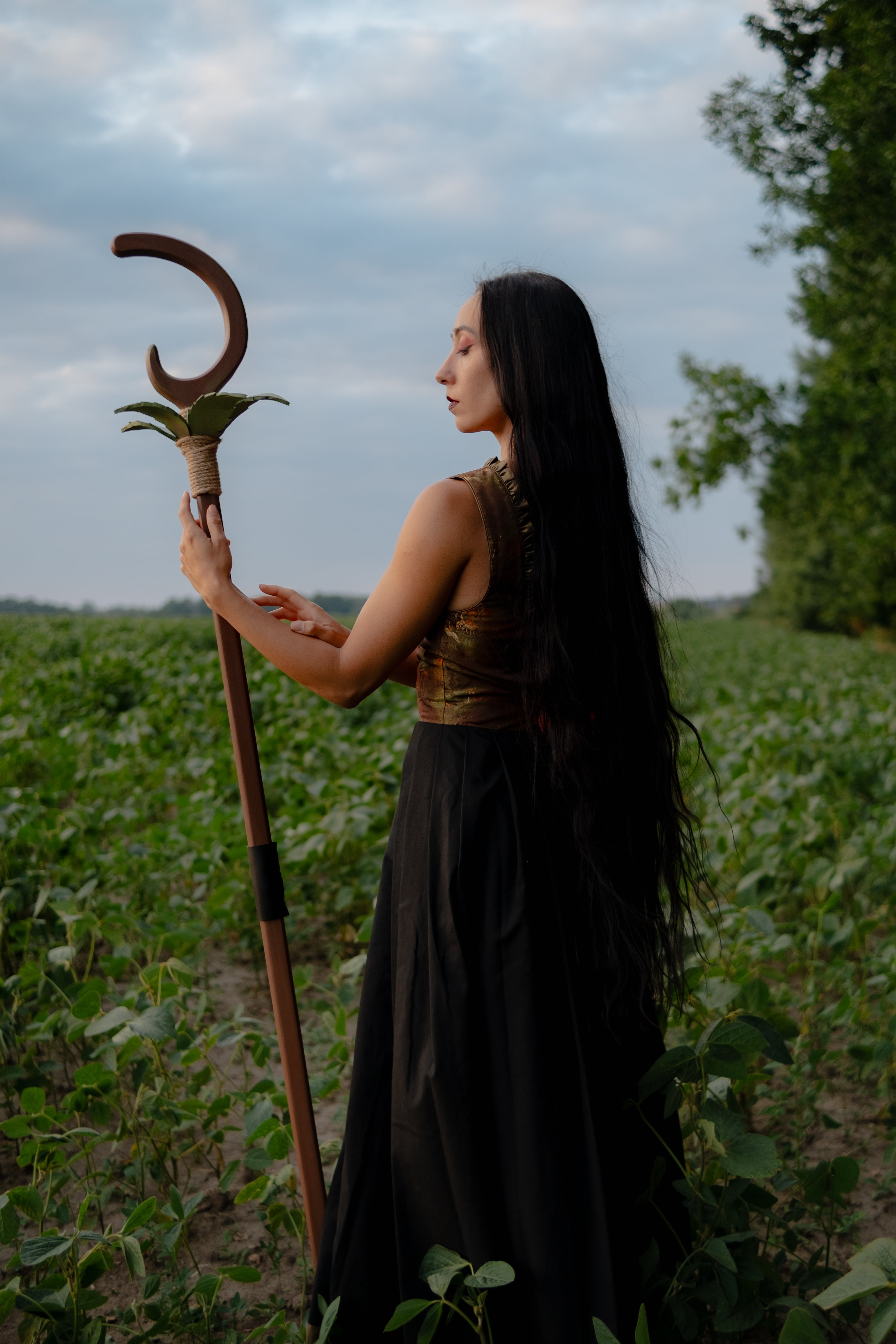 Full length handmade wooden crescent staff with leaf details for fantasy photoshoot
