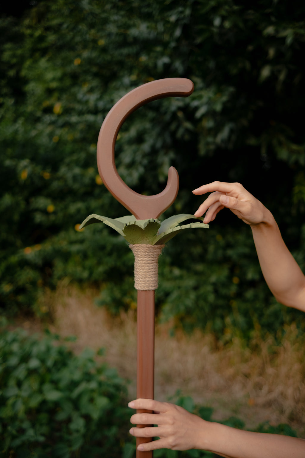 Close-up of crescent-shaped top with stylized green EVA foam leaves