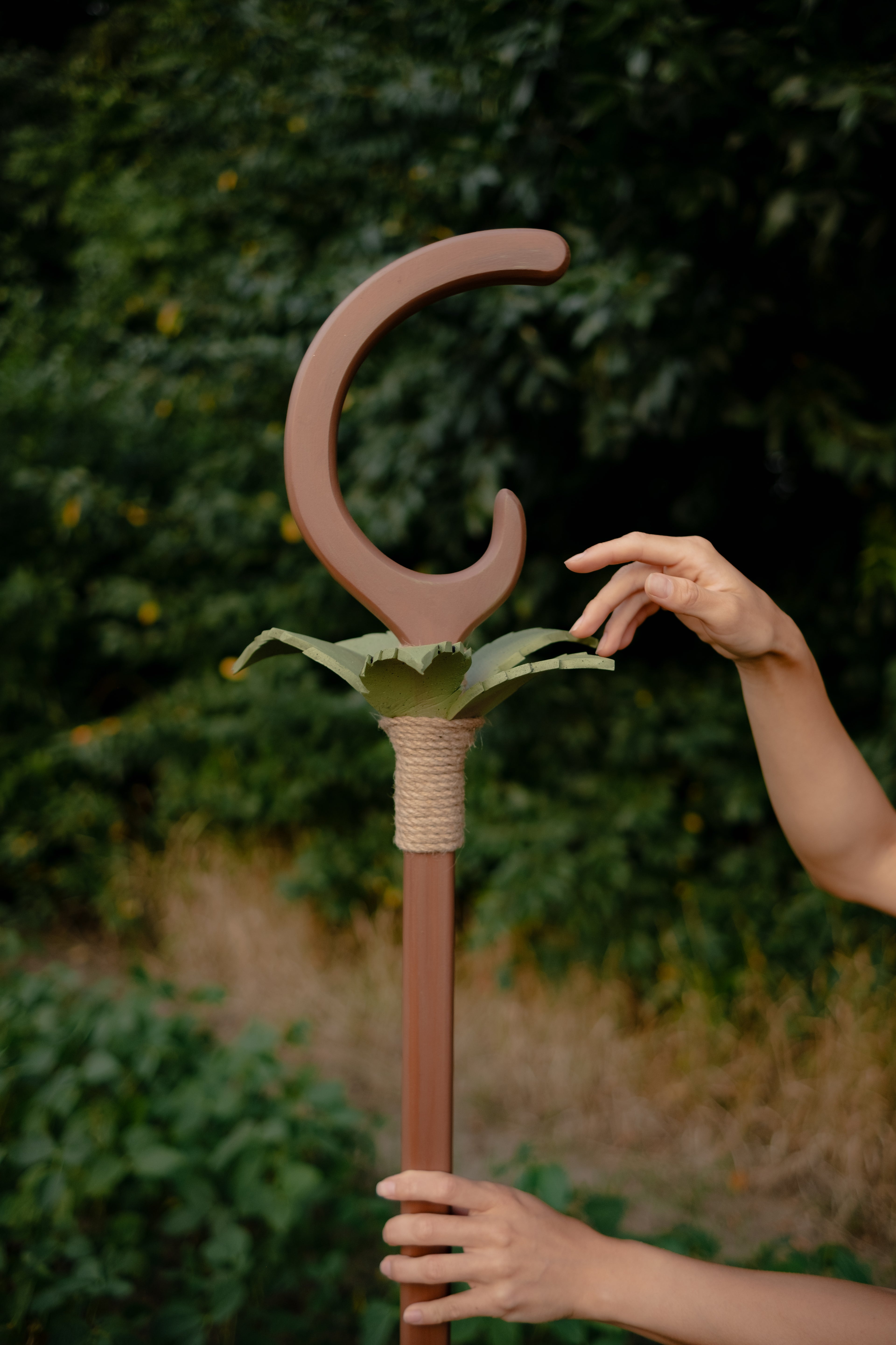 Close-up of crescent-shaped top with stylized green EVA foam leaves