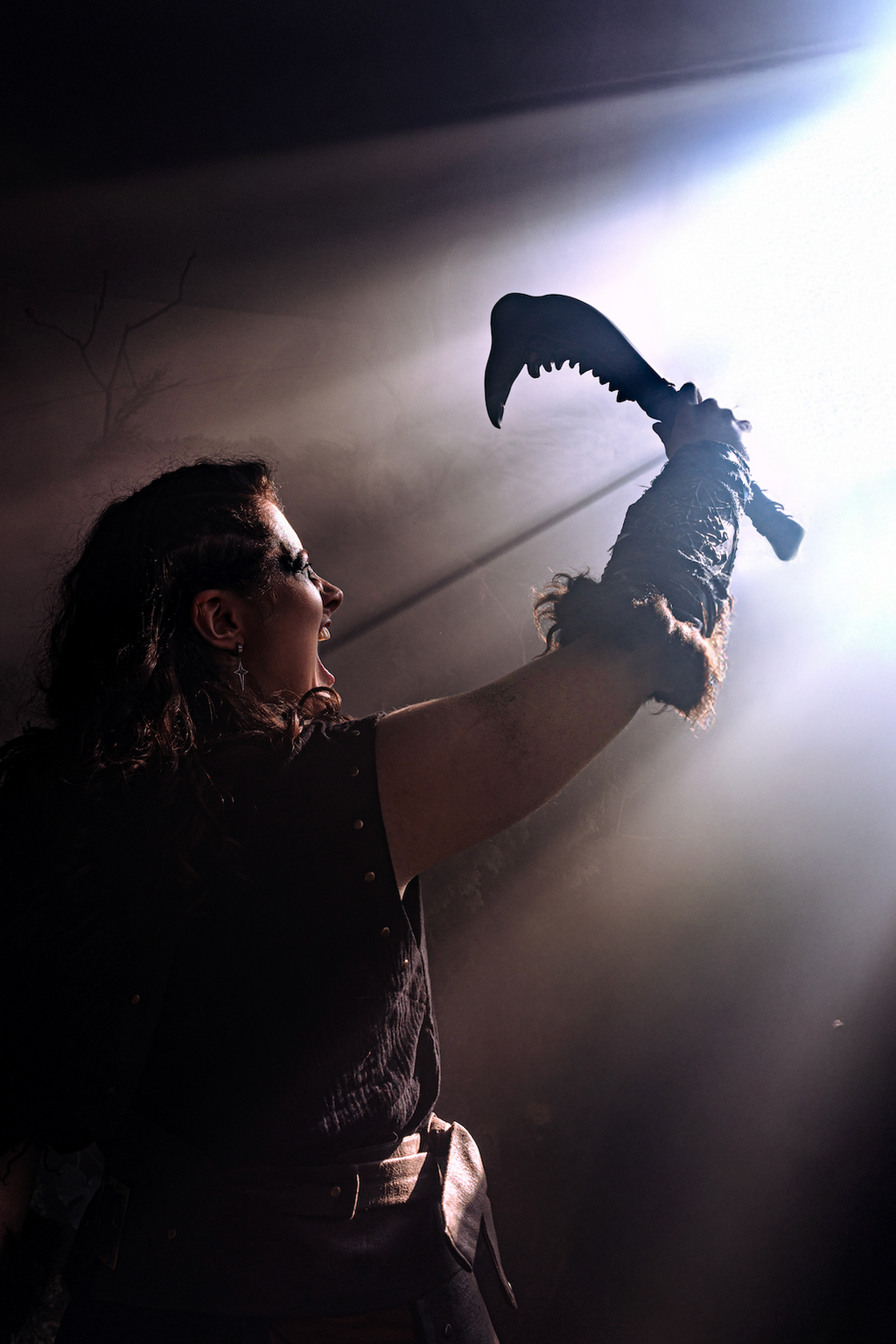 Bone-style jaw shaped display piece with carved decorative surface