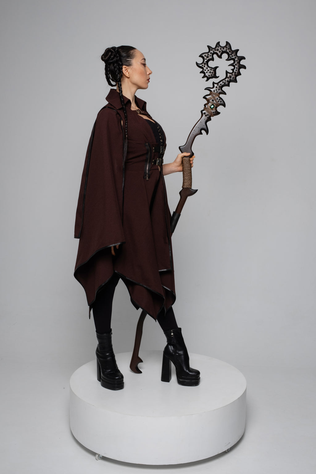 Dark forest fantasy staff shown with woodland-inspired costume outfit