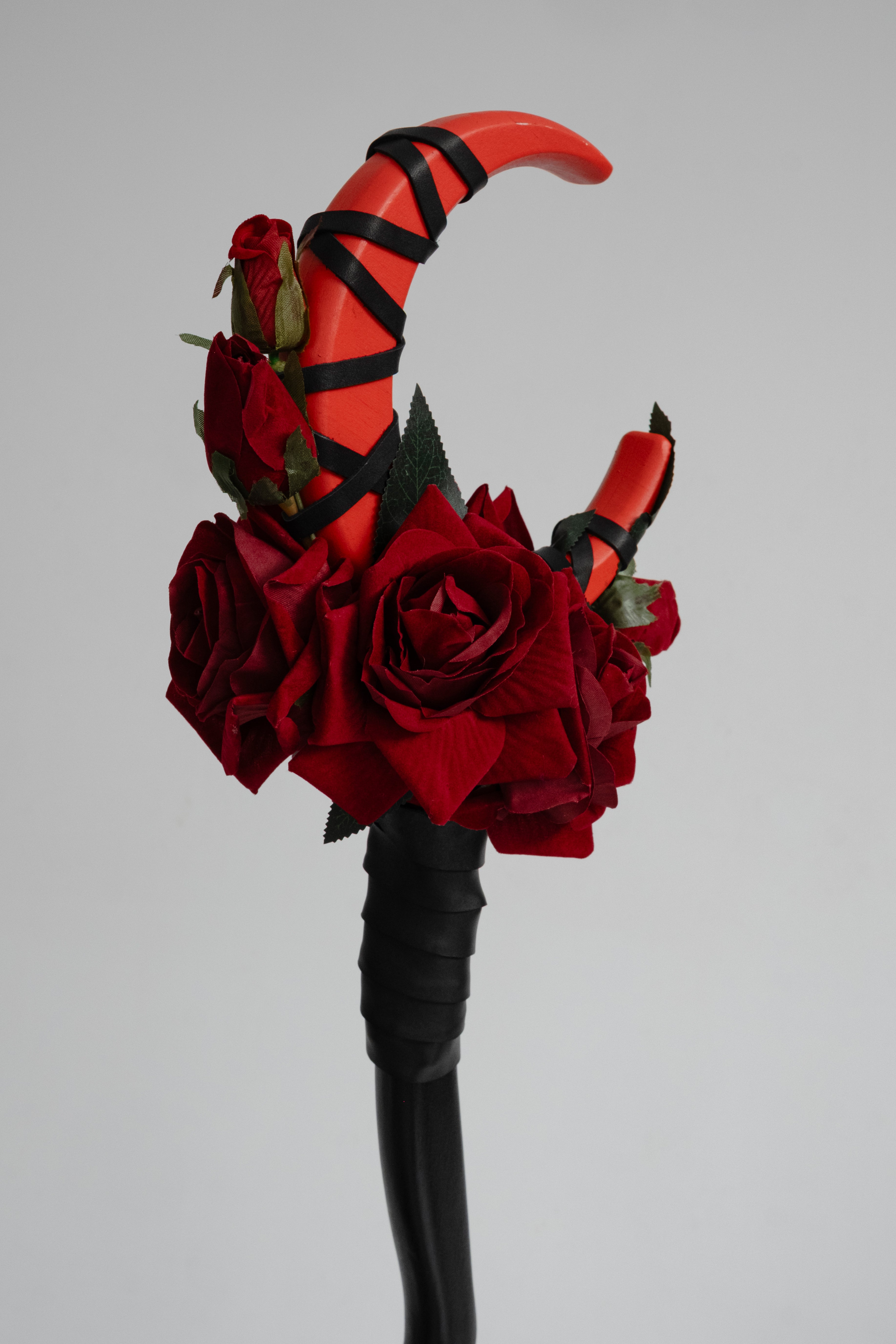 Detail of Blood Rose Crescent Moon Staff with dark red rose elements
