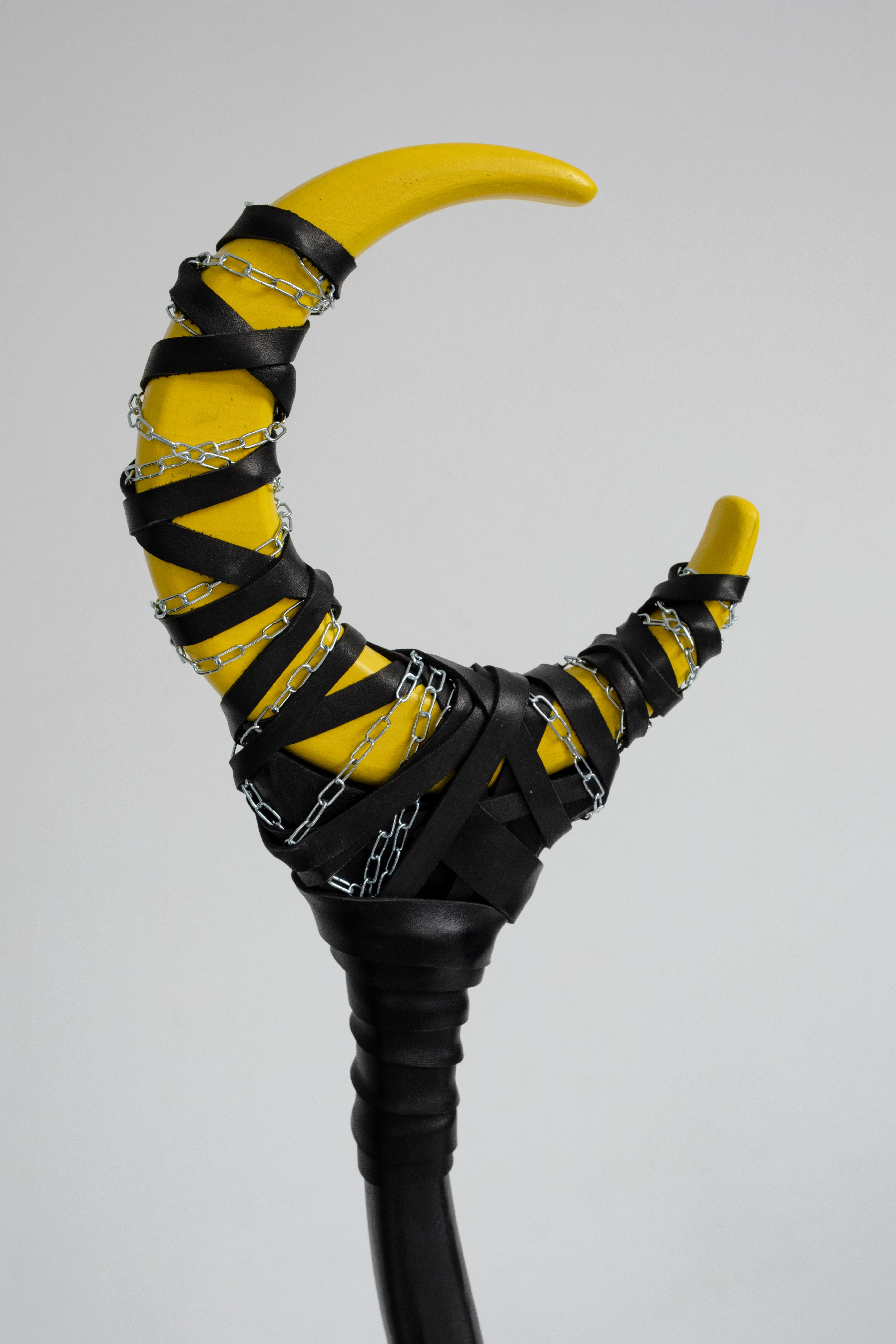 Detail of Yellow Moon Sting Chained Crescent Moon Staff with chain and bright fantasy finish