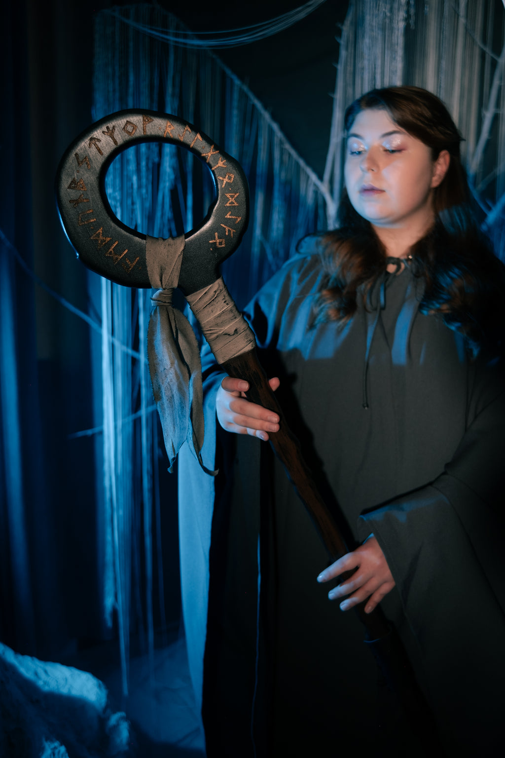 Rune-inspired fantasy staff with bold circular silhouette