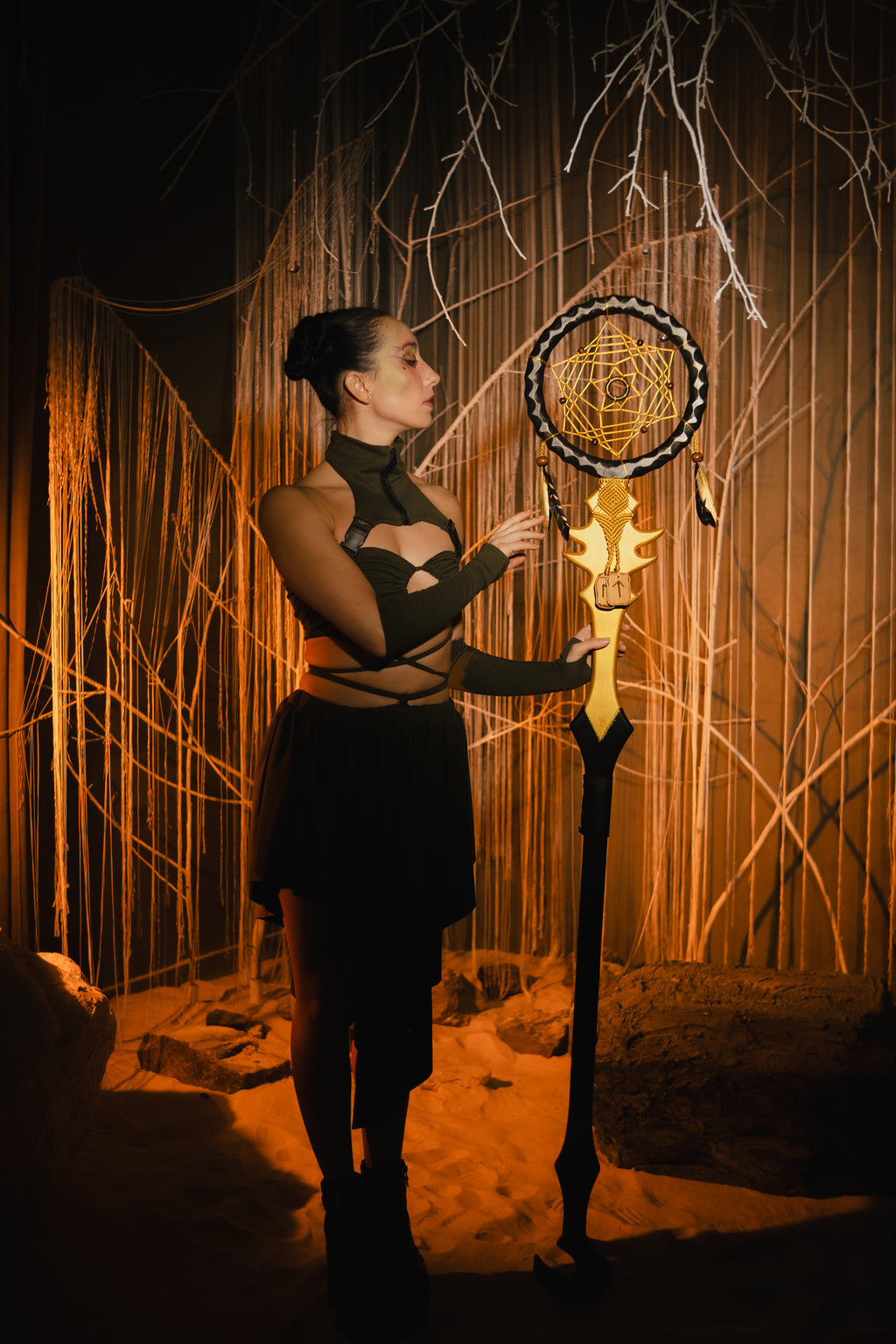 Sacred Web Staff handcrafted wooden fantasy prop in Golden Black with woven center and feather accents